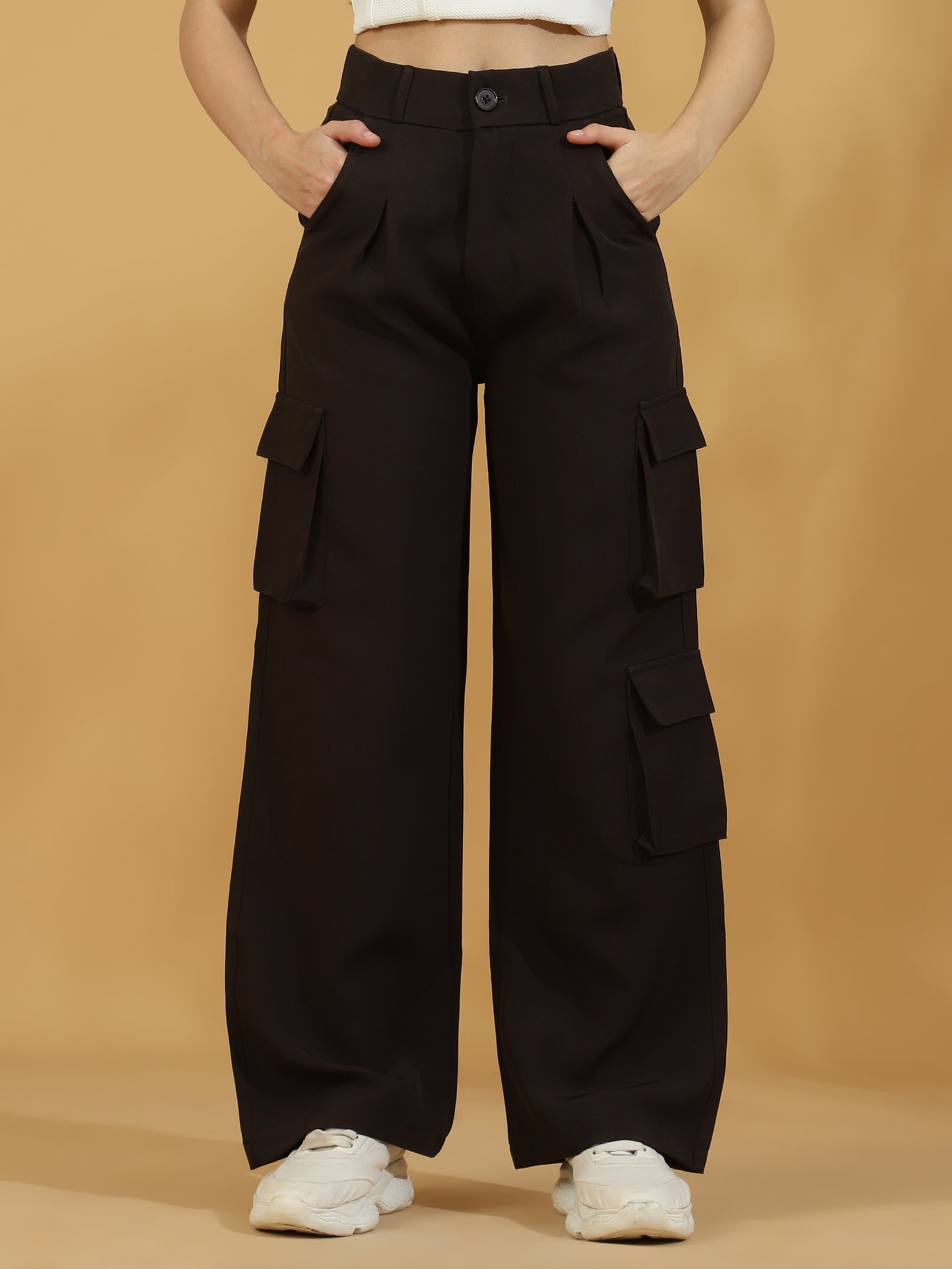 A pair of wide leg, dark brown baggy pants with multiple pockets, worn by a model